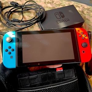 Nintendo Switch flawless plus Mario kart deluxe all accessories and two cases